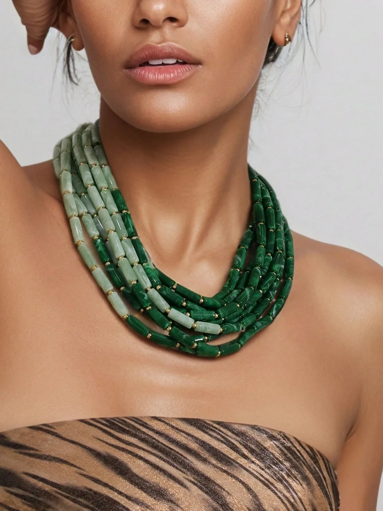 Exaggerated multi-layered necklace with ombre green beads