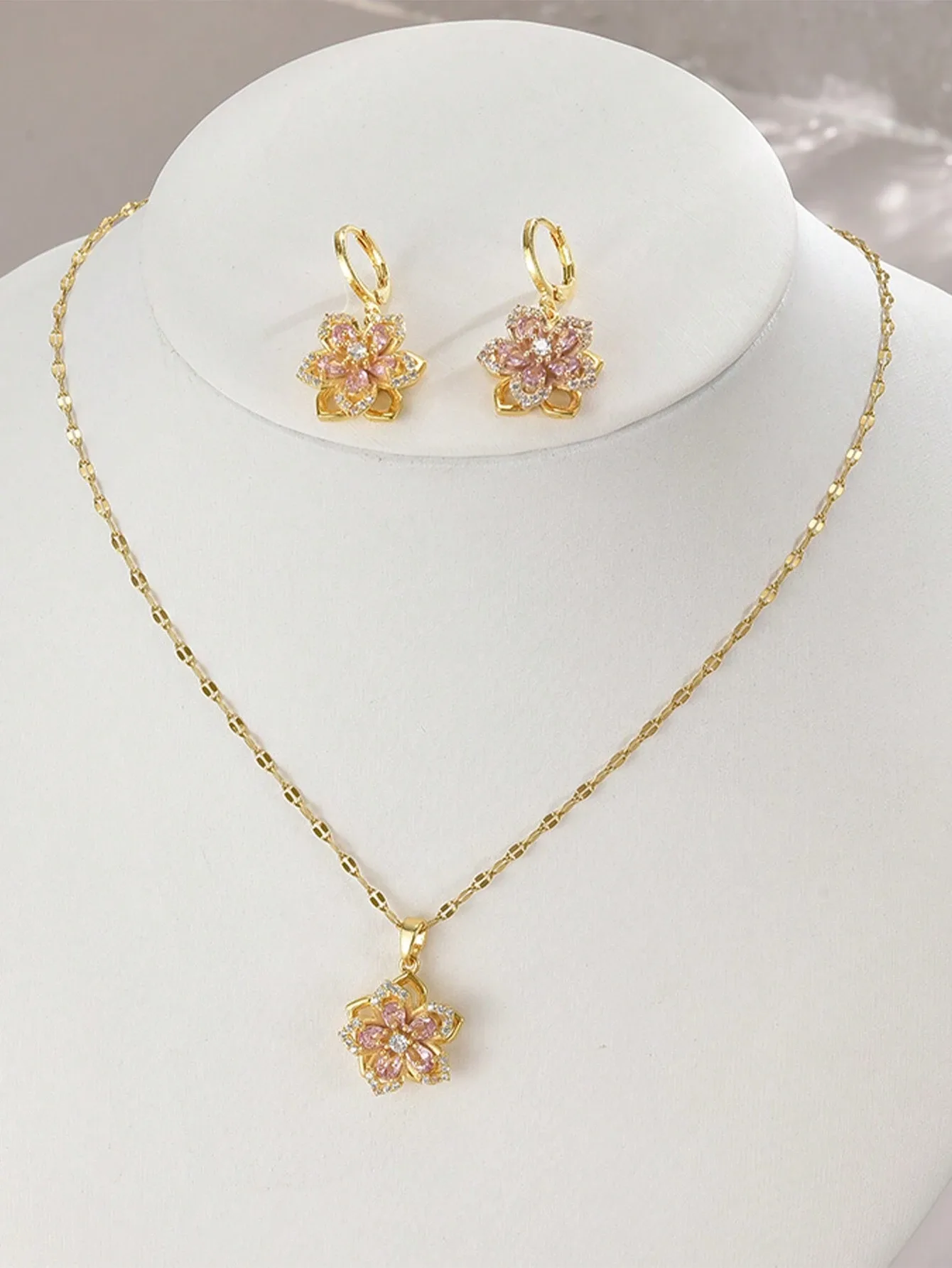 Women's stainless steel necklace adorned with five-petaled cubic zirconia flowers + a pair of women's stainless steel earrings