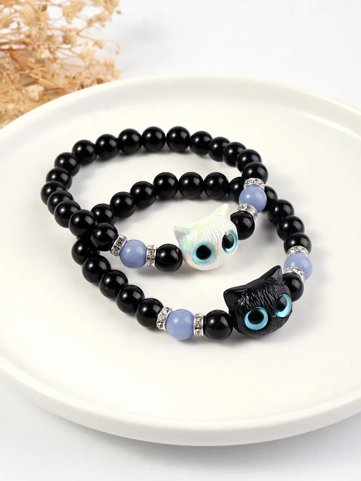 2 light-up bracelets with large, beautiful cat eyes