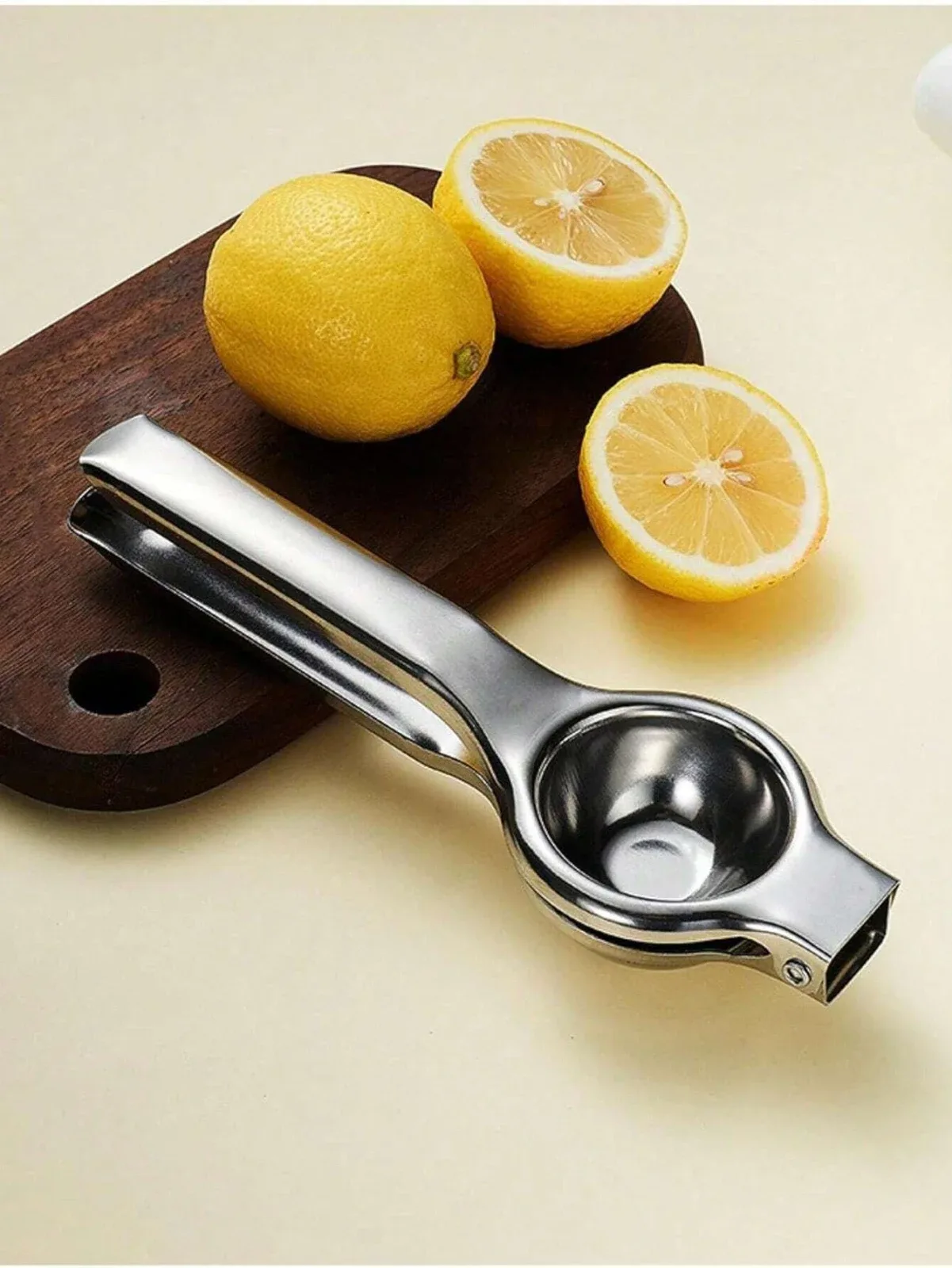 A manual stainless steel citrus juicer (for lemons and oranges), a modern way to get fresh juice.
