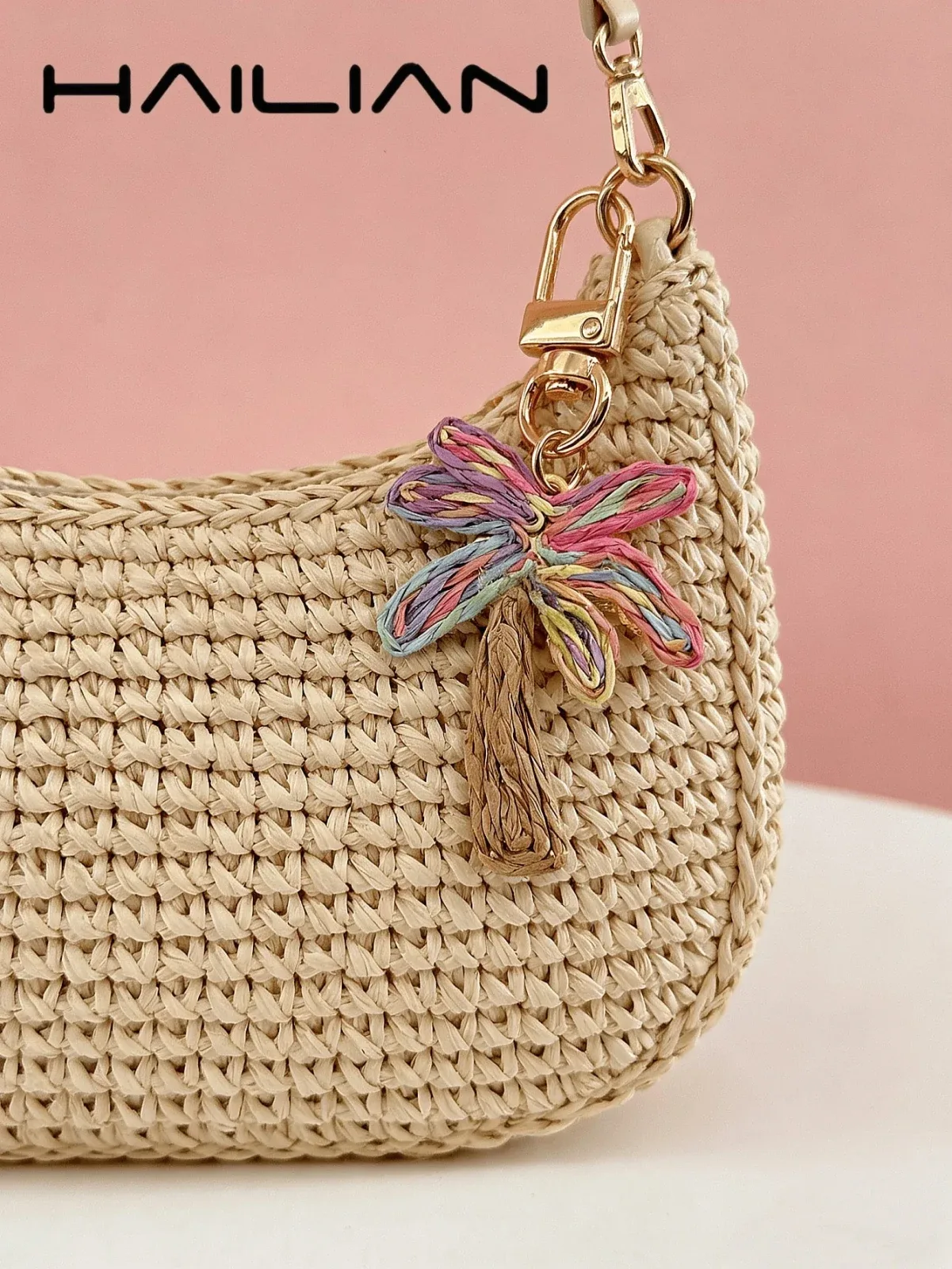 HAILIAN's charming coconut tree-shaped accessory, woven from raffia straw, showcases an intricate weave in a variety of colors