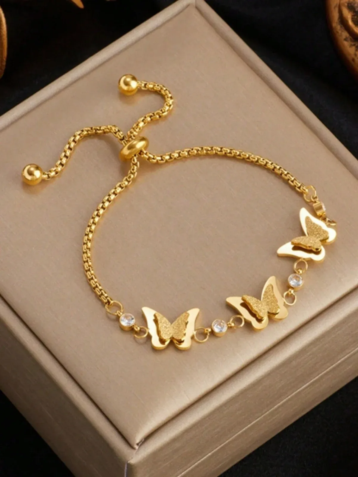 Small, simple, multi-functional gold pullover with a modern