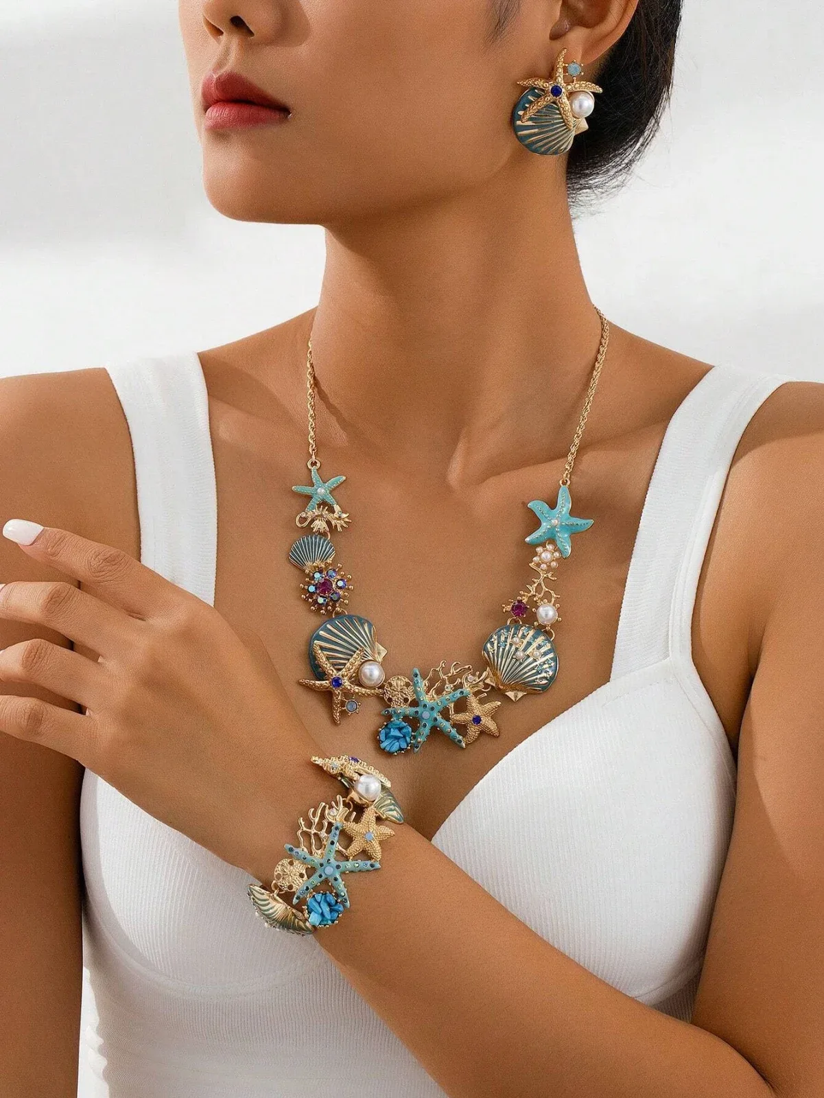 One-piece luxury starfish necklace, blue-plated seashell earrings, faux turquoise seahorse bracelet